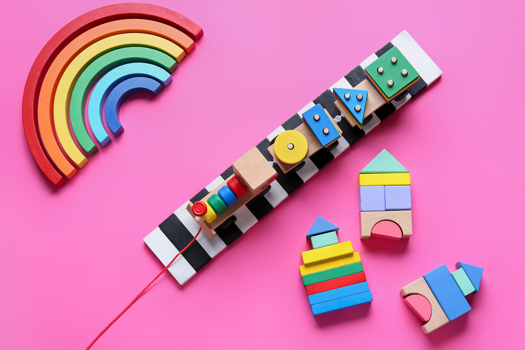 Toy Train with Building Blocks on Pink Background